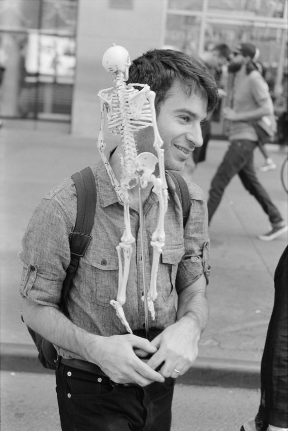 Student walking with a skeleton